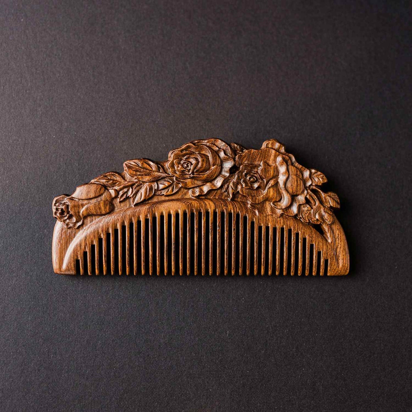 Small Carved Sandalwood Comb with carved floral design