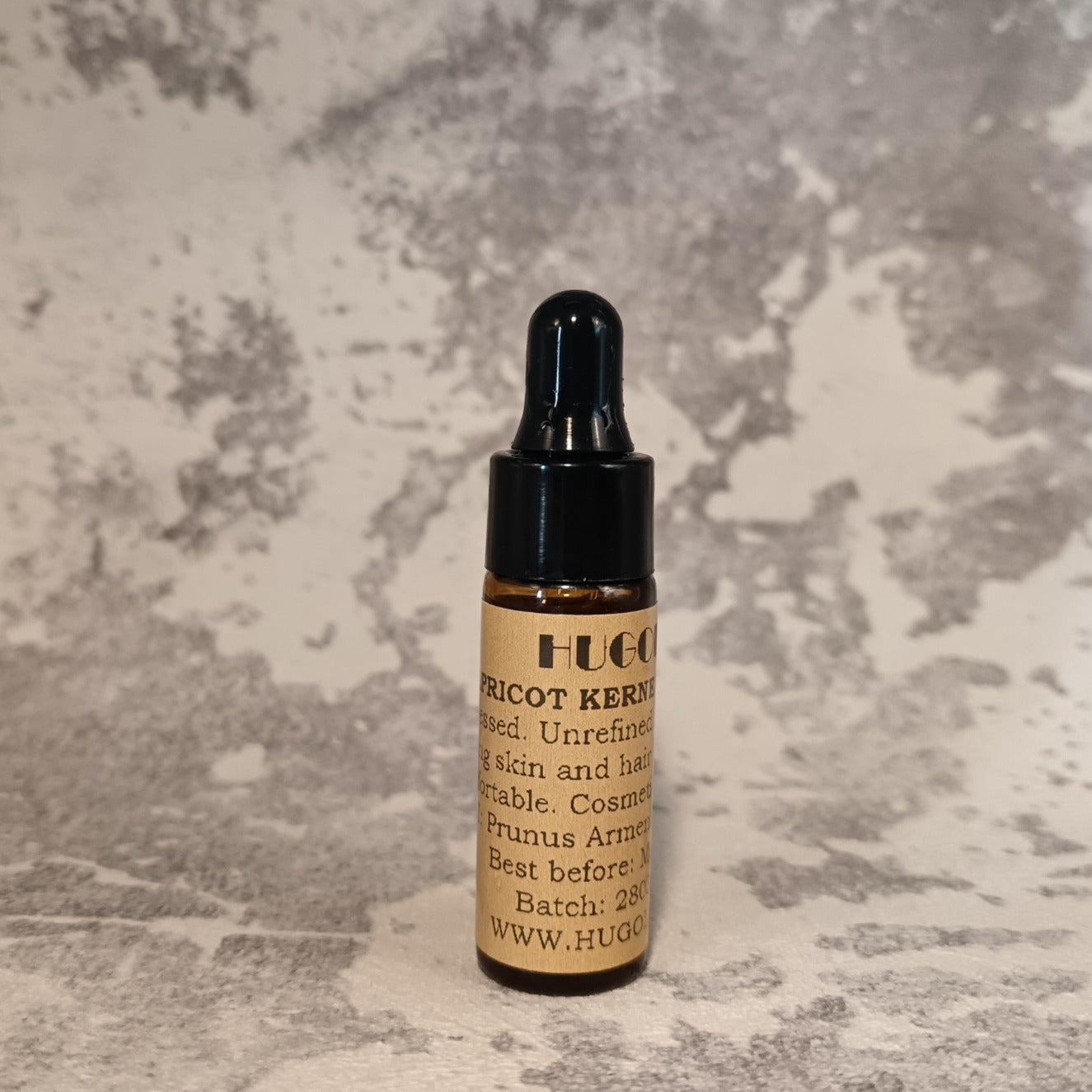 5ml apricot oil mini bottle for lightweight facial oil on marble background