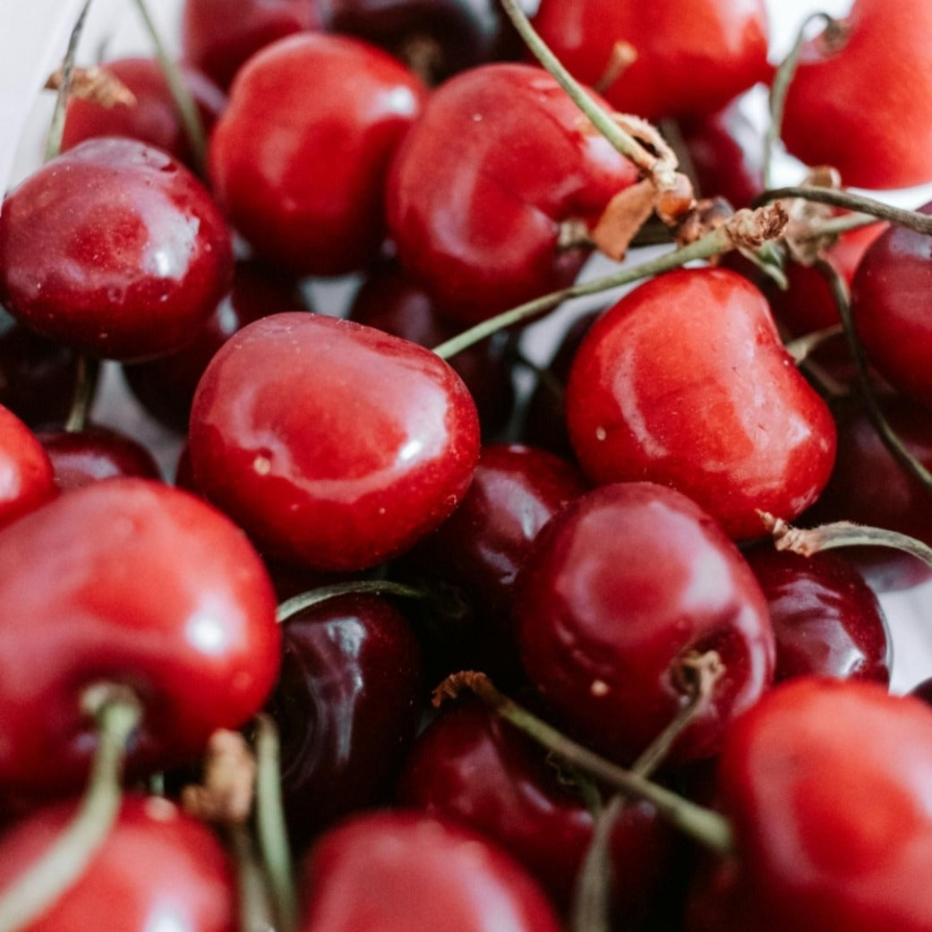 Close-up of fresh cherries used in natural skincare oil production
