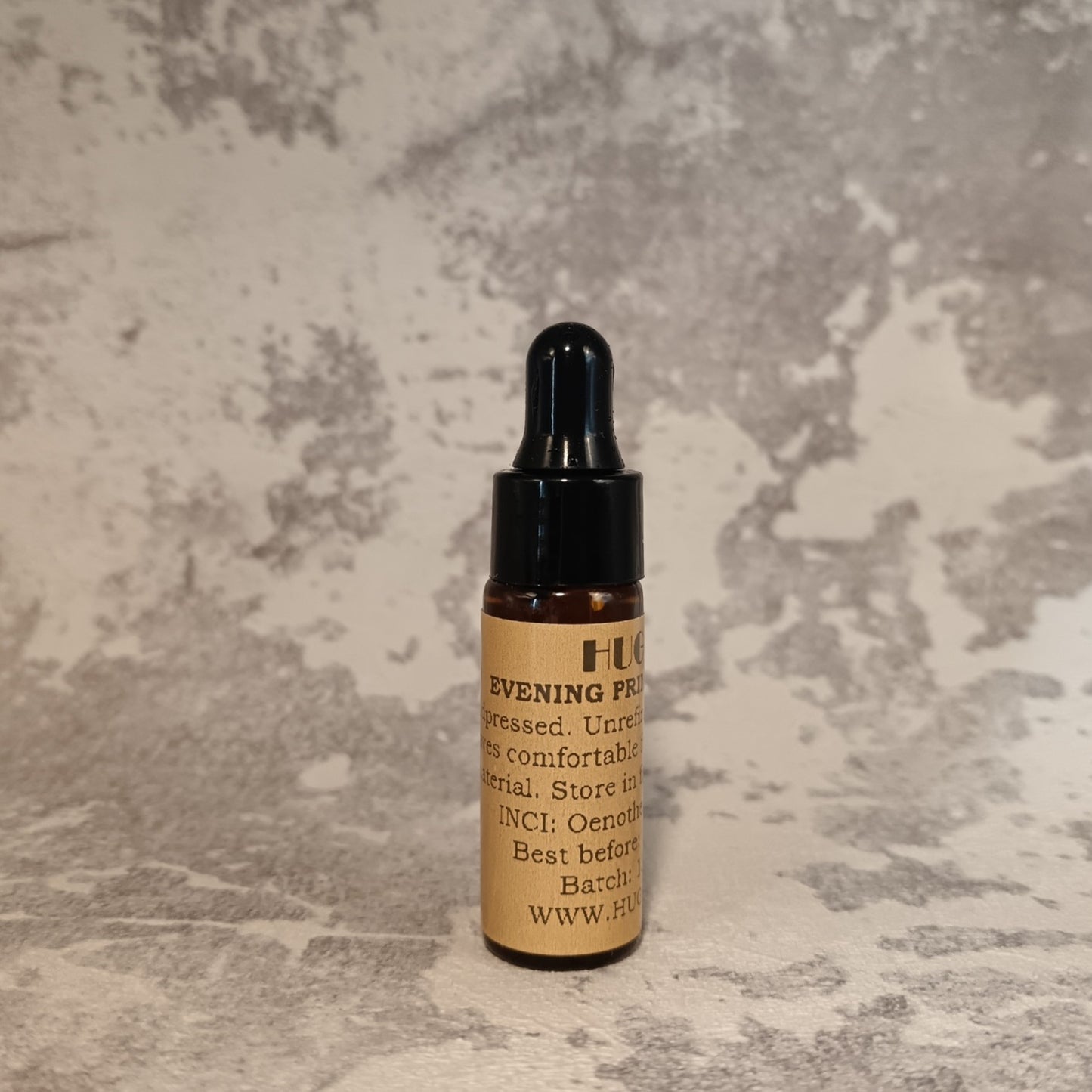 5ml primrose oil mini bottle for calming facial oil on marble surface
