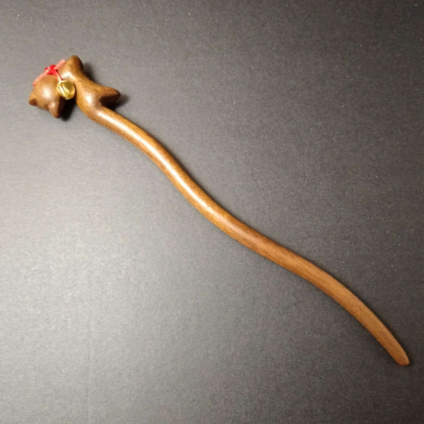 Brown wooden hair stick with bell