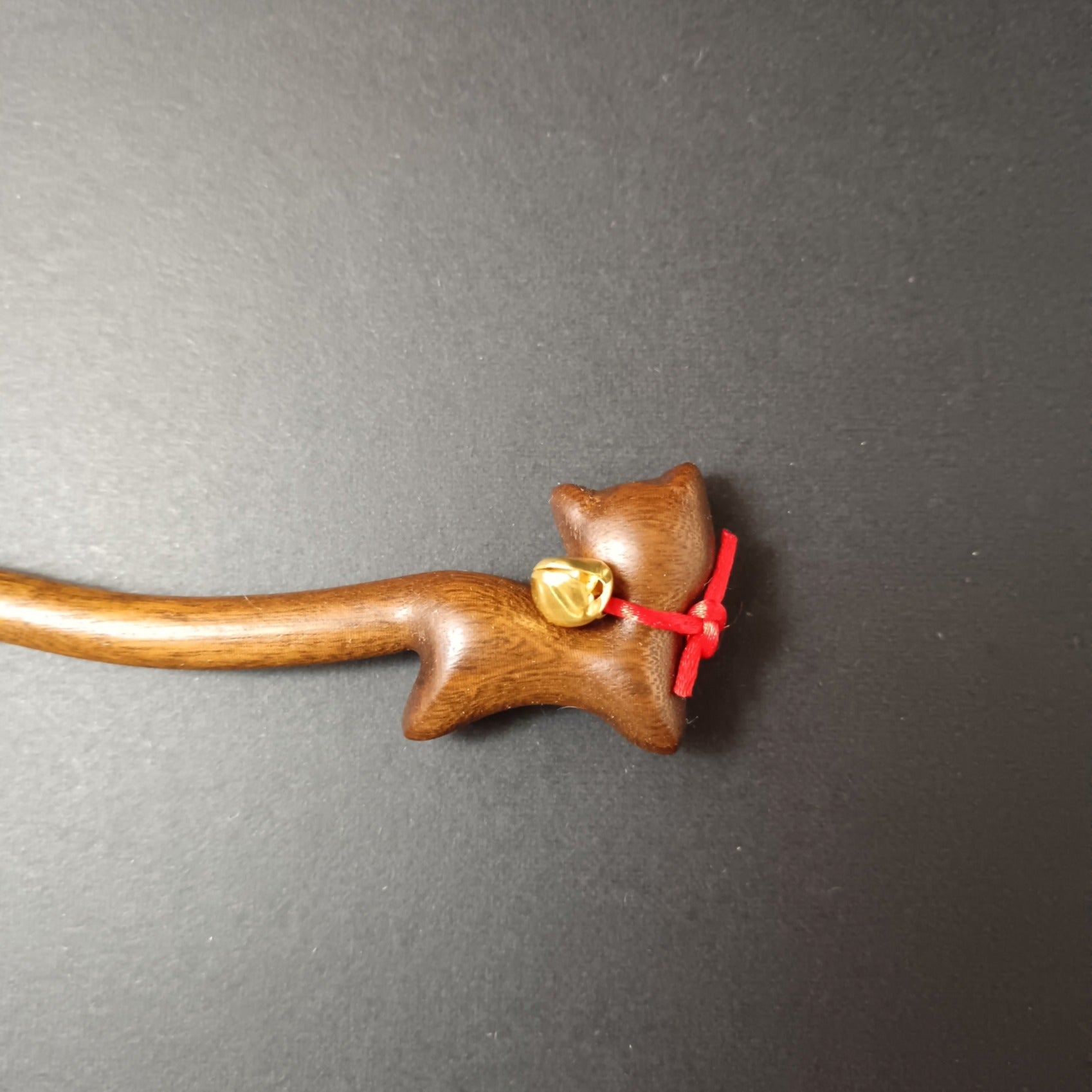 Close up to wooden hair pin cat shaped