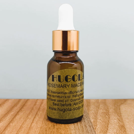 Rosemary-infused oil macerate for hair in a glass bottle