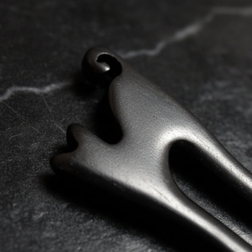 Close-up of cat shaped black hair pin