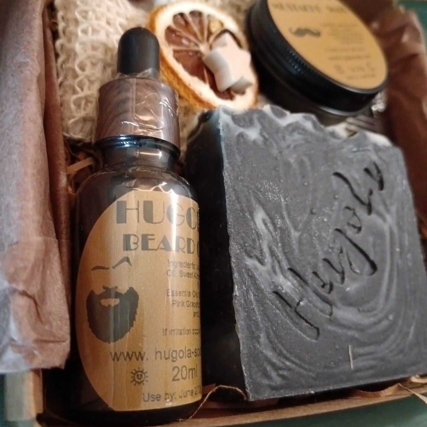 Hugola Beard oil bottle with a bar of soap in a box
