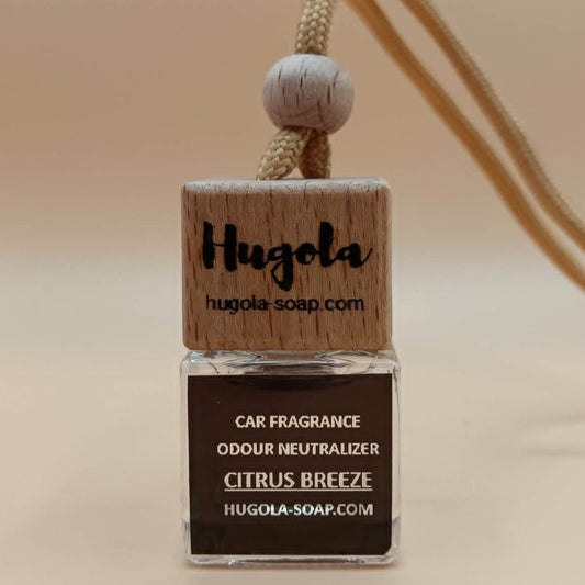 Hugola car fragrance and odor neutralizer with wooden design on a beige background