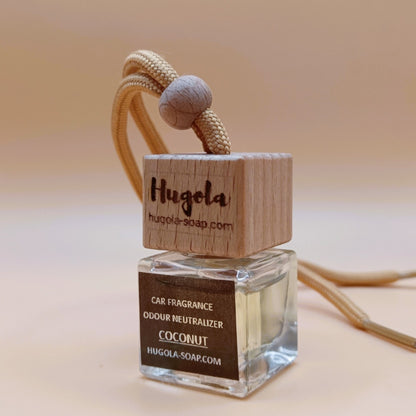 Hugola car fragrance diffuser, Coconut scent, angled view of glass bottle with wooden lid