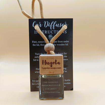 Hugola car fragrance diffuser, Coconut scent, displayed with instruction card and wooden cap