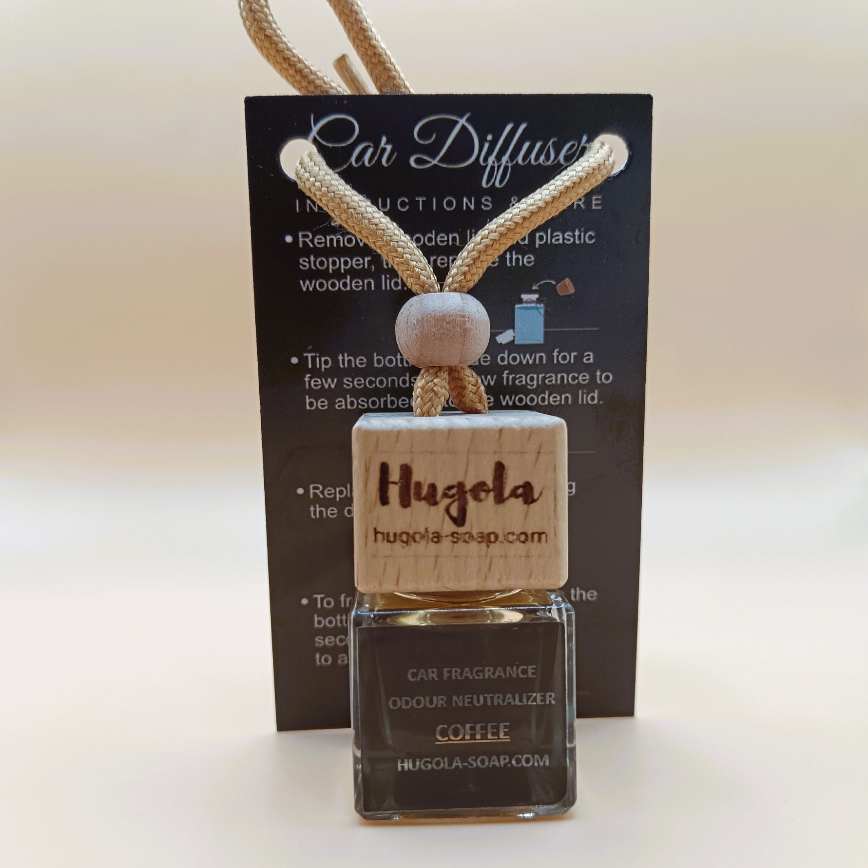 Hugola car fragrance diffuser, Coffee scent, displayed with instruction card and wooden cap