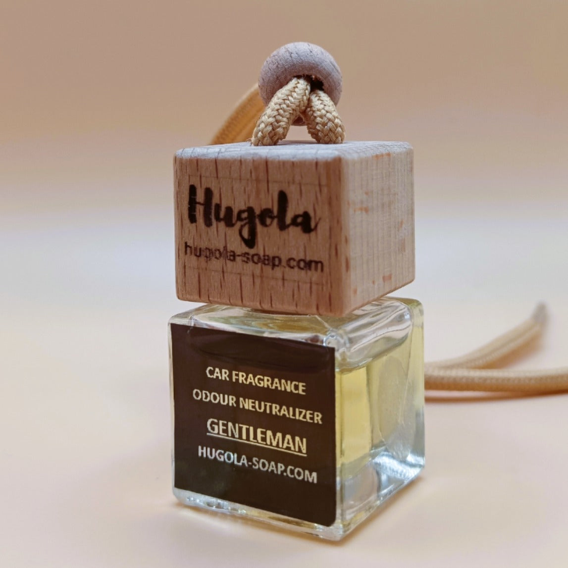 Hugola car fragrance diffuser,  Gentleman scent, angled view of glass bottle with wooden lid