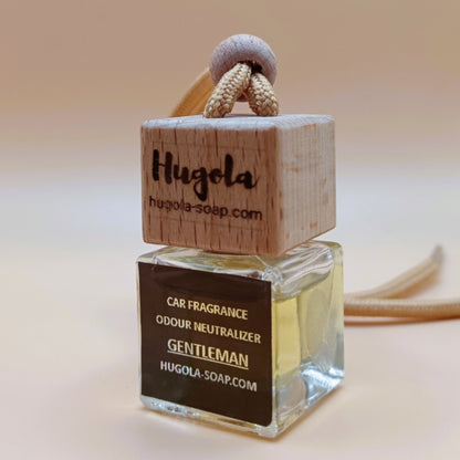 Hugola car fragrance diffuser,  Gentleman scent, angled view of glass bottle with wooden lid