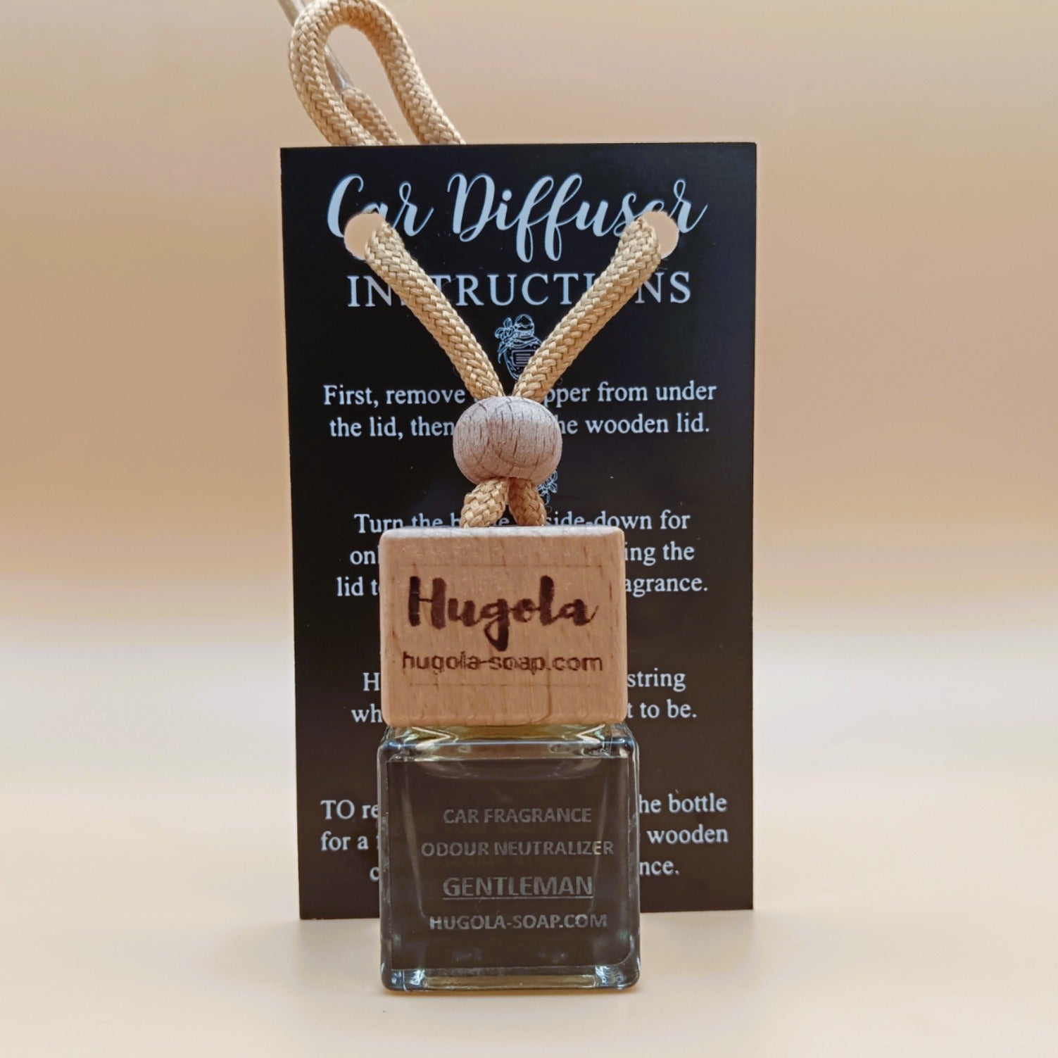 Hugola car fragrance diffuser, Gentleman scent, displayed with instruction card and wooden cap