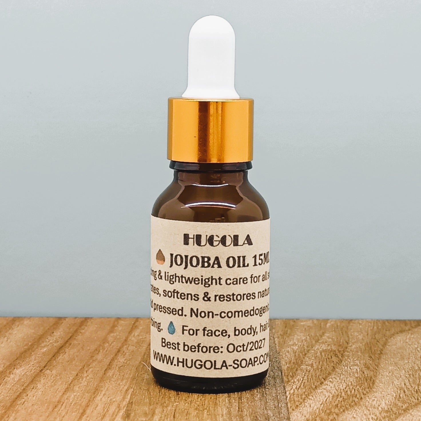 Jojoba Oil, natural cold-pressed facial and body oil in glass bottle