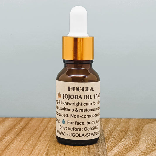 Jojoba Oil, natural cold-pressed facial and body oil in glass bottle