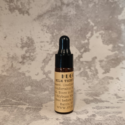 5ml milk thistle oil travel bottle for calming face oil on marble background