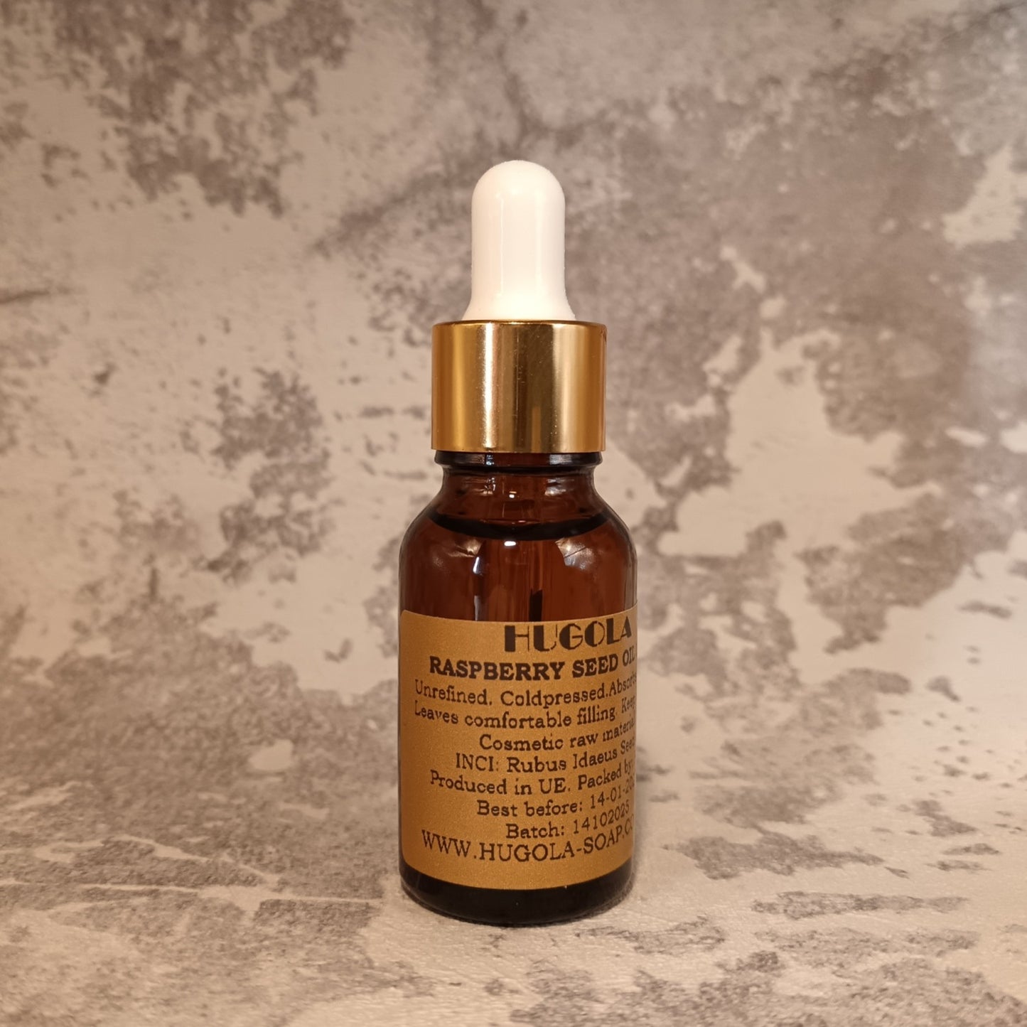 15ml raspberry seed oil dropper bottle for antioxidant skin care on marble background