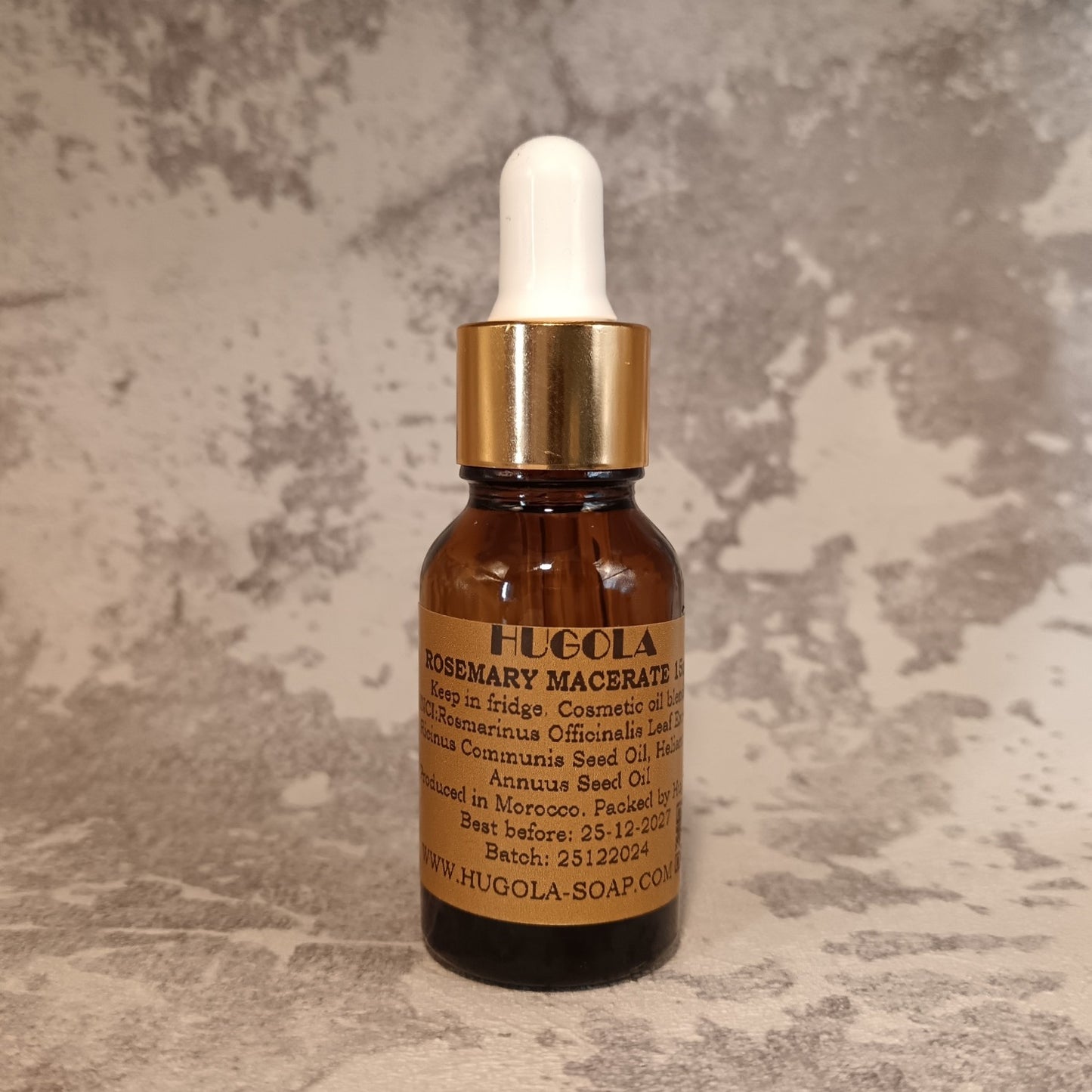 15ml rosemary hair oil dropper bottle for hair growth and scalp care on marble surface