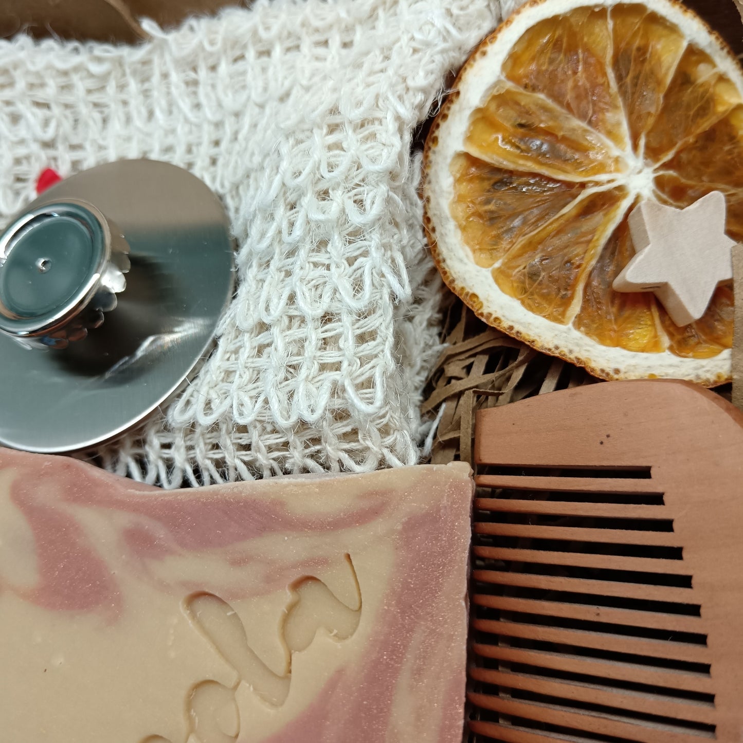 Bar of soap, comb, and magnetic soap hanger