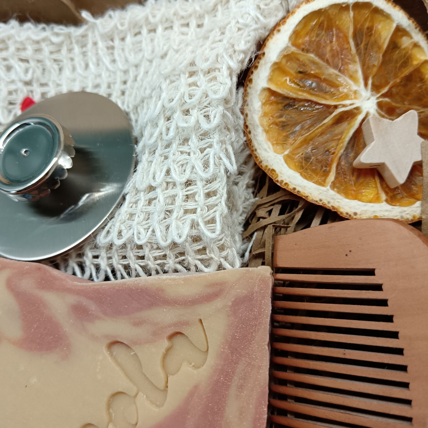 Bar of soap, comb, and magnetic soap hanger
