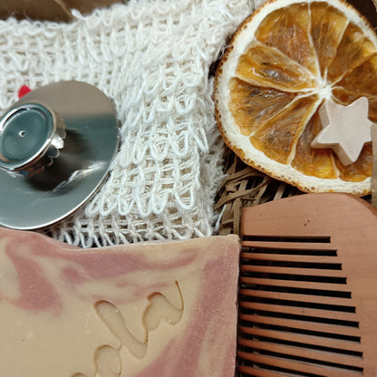 Bar of soap, comb, and magnetic soap hanger