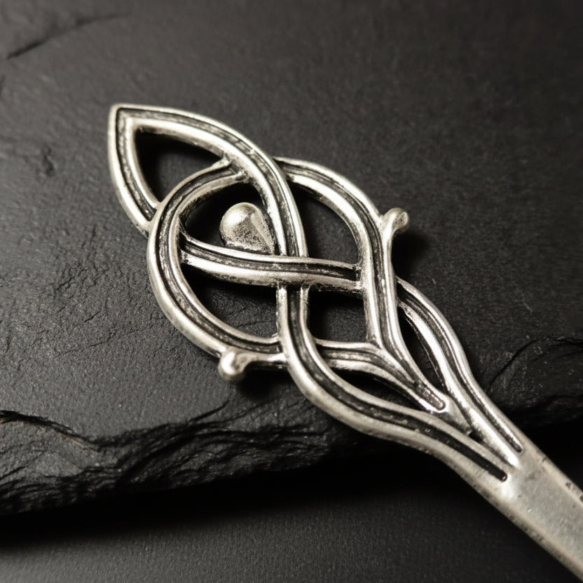 Close up to silver hairpin with Viking design 