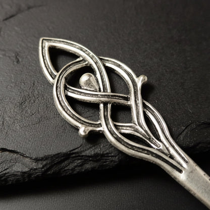 Close up to silver hairpin with Viking design 