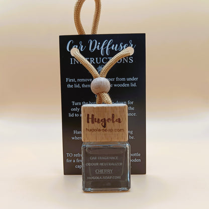 Hugola car fragrance diffuser, Cherry scent, displayed with instruction card and wooden cap